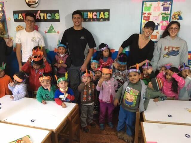 Family with kids at day care center in Peru